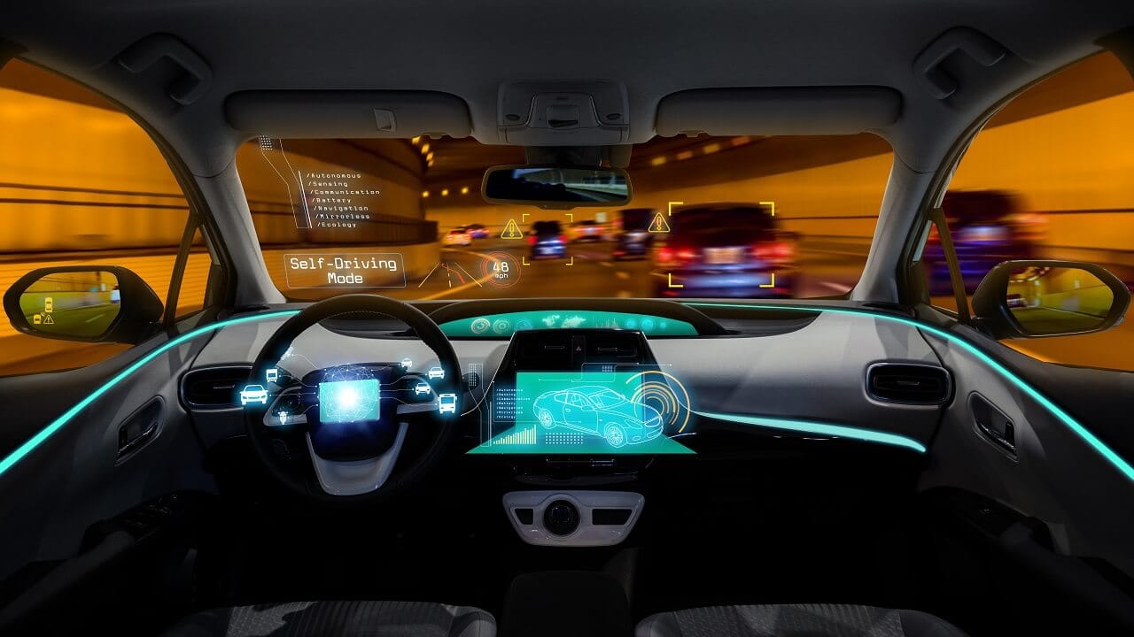 Interior self-driving interface showing digital overlays, hazard detection, and autonomous mode information